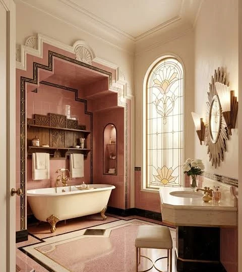 A pink art-deco bathroom with a clawfoot tub, a stepped arch and a stained-glass window